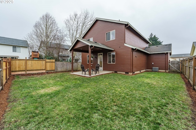 back of house with cooling unit, a yard, and a patio