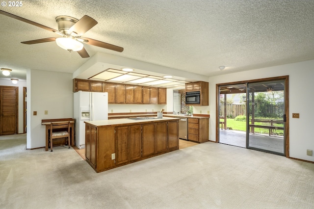 kitchen with a center island, light countertops, white appliances, brown cabinetry, and light carpet