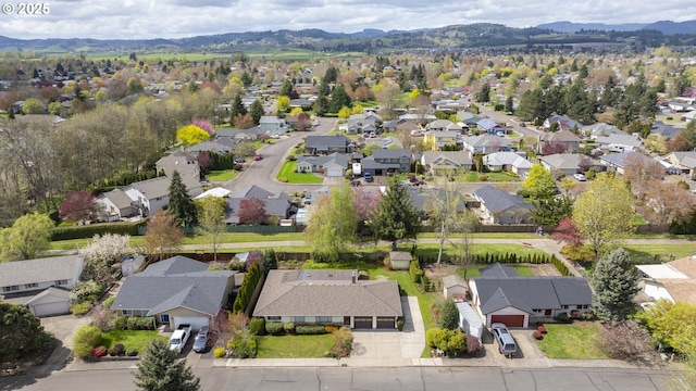 birds eye view of property with a mountain view and a residential view