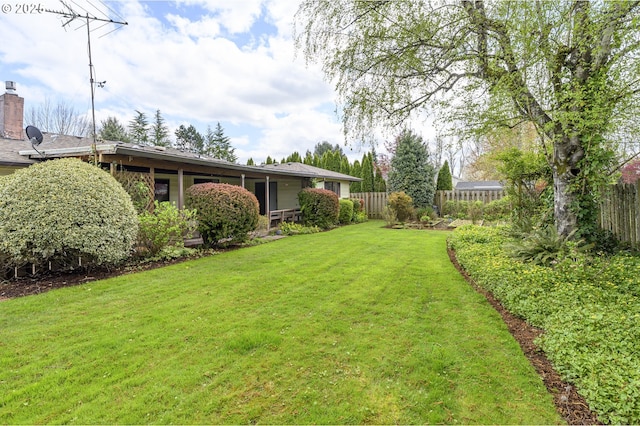 view of yard with fence