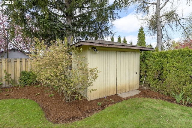 view of shed with fence