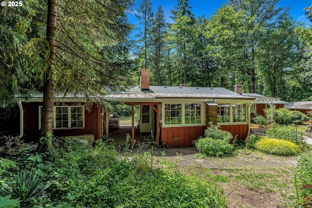 63645 E Barlow Trail Rd, Brightwood, OR 97011 - back of house with a chimney, board and batten siding, and a sunroom