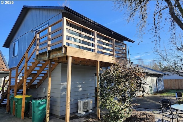 back of house with stairs, a patio, and fence