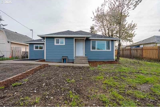 view of front of home with fence and entry steps
