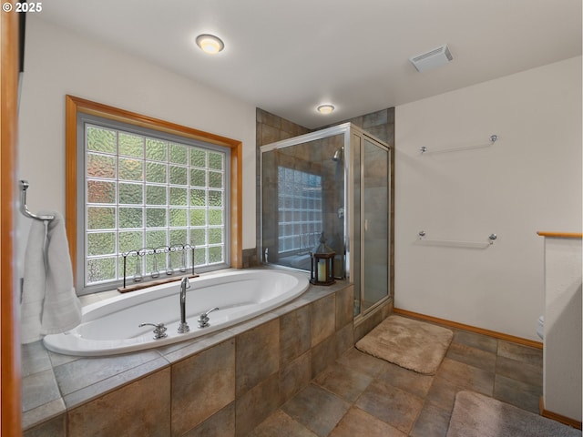 full bath with a bath, visible vents, a shower stall, baseboards, and toilet