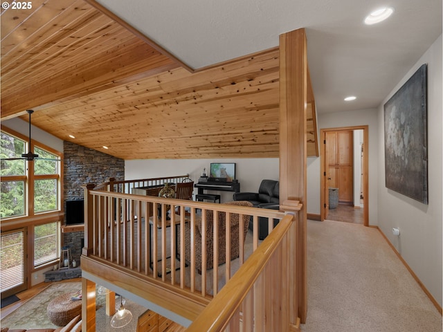 corridor with baseboards, carpet flooring, recessed lighting, and lofted ceiling
