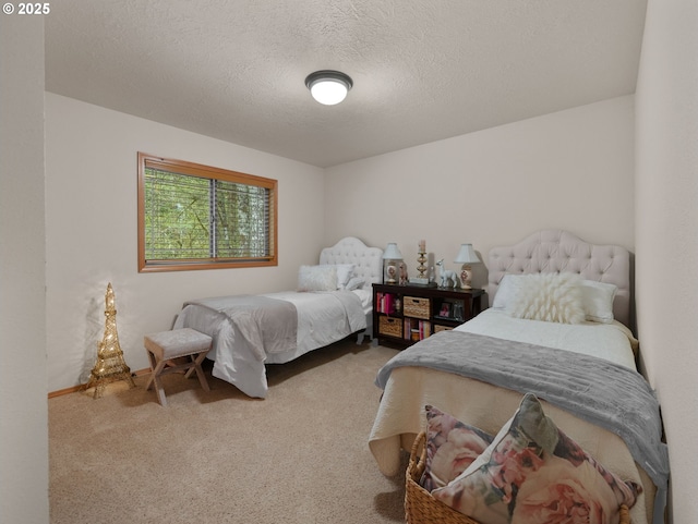 carpeted bedroom with a textured ceiling
