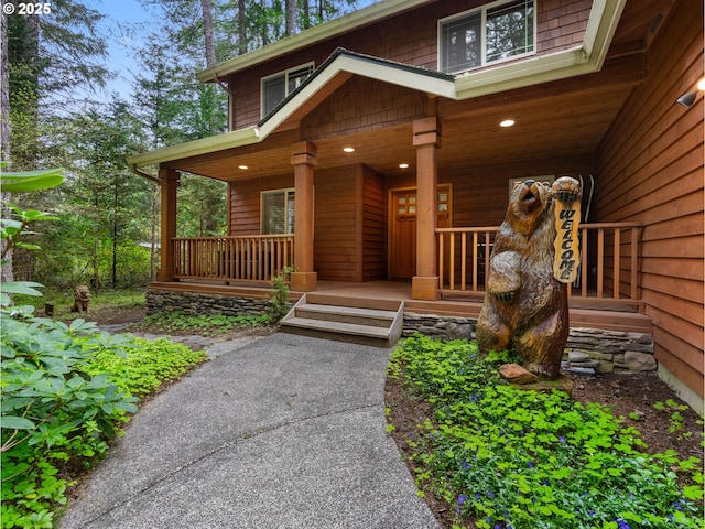 view of exterior entry featuring a porch
