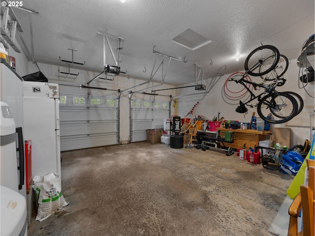 garage featuring a garage door opener and freestanding refrigerator