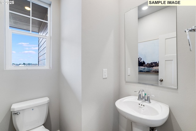 bathroom with a sink and toilet