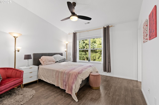 bedroom featuring dark wood-type flooring, ceiling fan, and lofted ceiling