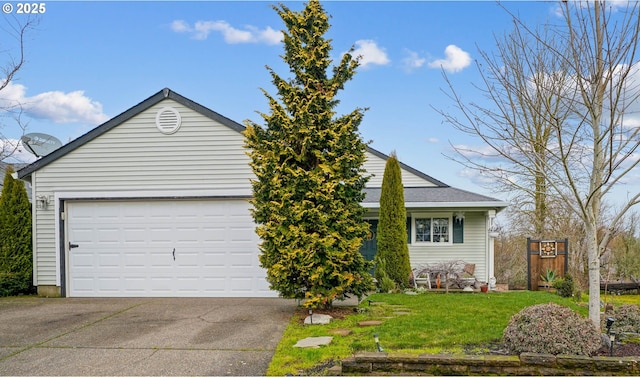 view of front of home with a garage and a front yard