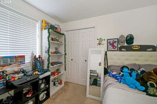 carpeted bedroom featuring a closet