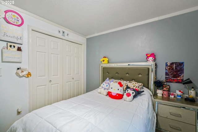 bedroom with ornamental molding and a closet