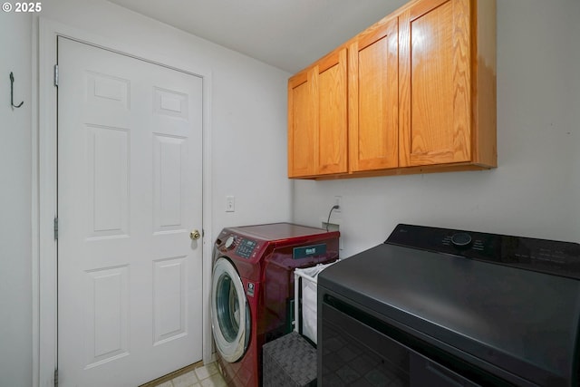 laundry area with cabinets and washer and dryer