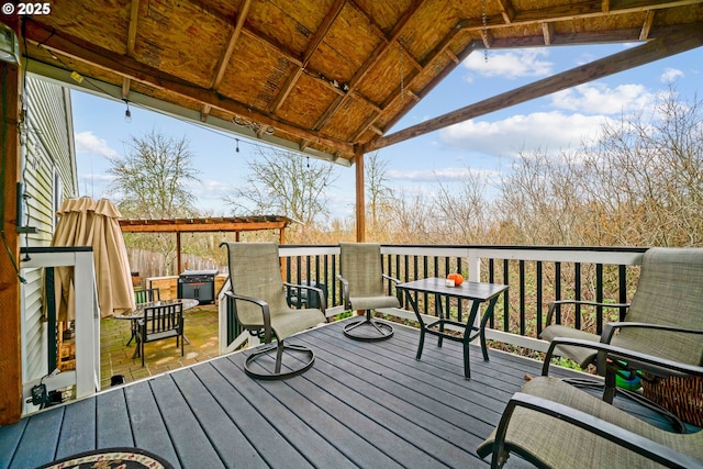 wooden deck with a jacuzzi