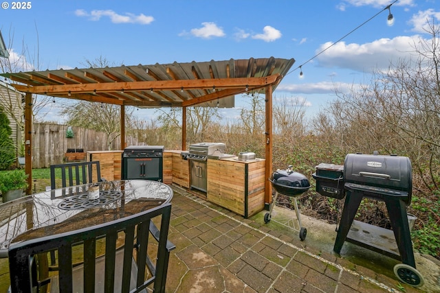 view of patio with a grill and an outdoor kitchen