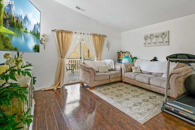 living room with lofted ceiling and dark hardwood / wood-style flooring