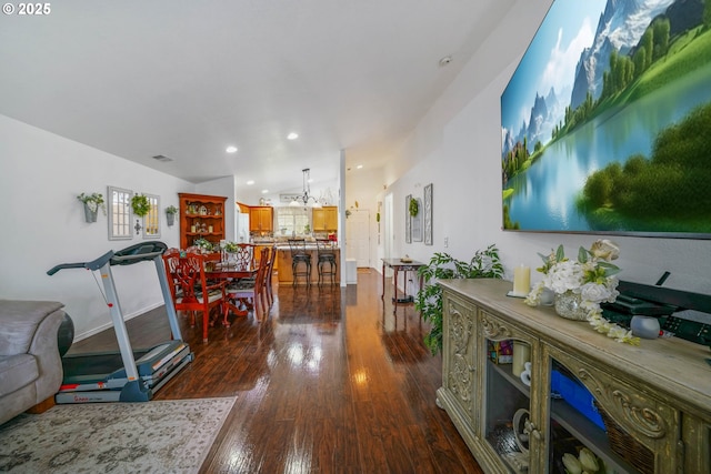 living room featuring lofted ceiling and dark hardwood / wood-style flooring