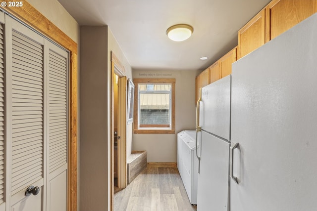 2039 N Jantzen Ave, Portland, OR 97217 - interior space featuring separate washer and dryer, laundry area, light wood-style flooring, and baseboards