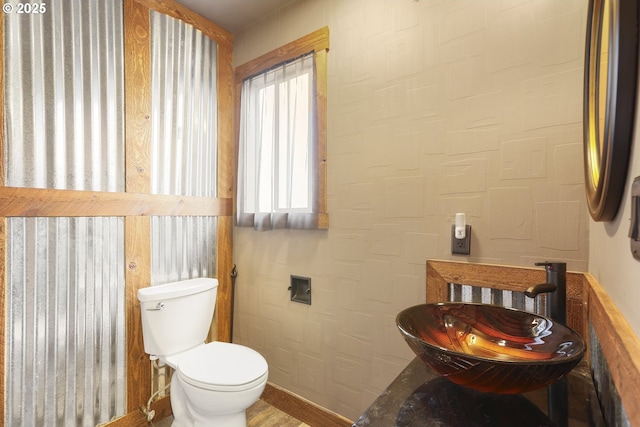 2039 N Jantzen Ave, Portland, OR 97217 - half bathroom with toilet, baseboards, and a sink