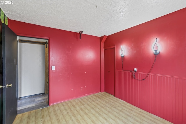2039 N Jantzen Ave, Portland, OR 97217 - spare room with a textured ceiling and wood finished floors