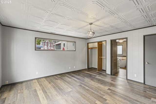 2039 N Jantzen Ave, Portland, OR 97217 - unfurnished bedroom with ensuite bathroom, wood finished floors, baseboards, and an ornate ceiling