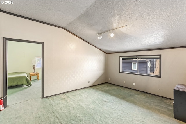 2039 N Jantzen Ave, Portland, OR 97217 - unfurnished bedroom with a textured ceiling, ornamental molding, carpet, and vaulted ceiling