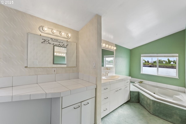 2039 N Jantzen Ave, Portland, OR 97217 - bathroom featuring a garden tub, vaulted ceiling, and vanity
