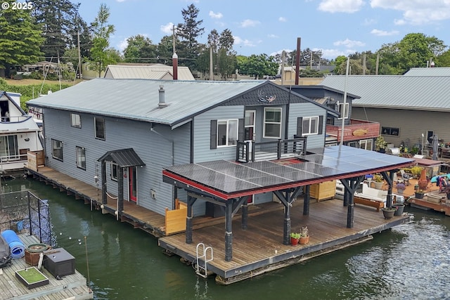 2039 N Jantzen Ave, Portland, OR 97217 - back of house featuring metal roof and a water view