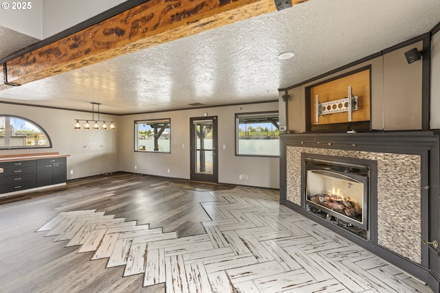 2039 N Jantzen Ave, Portland, OR 97217 - unfurnished living room with a textured ceiling, a fireplace, baseboards, and wood finished floors