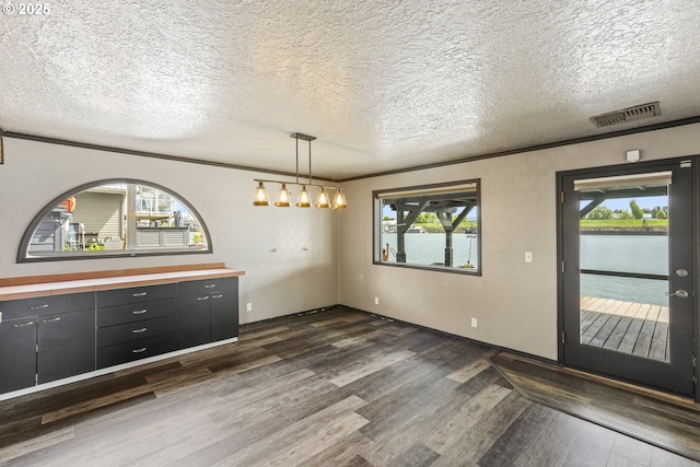 2039 N Jantzen Ave, Portland, OR 97217 - unfurnished dining area featuring a notable chandelier, visible vents, plenty of natural light, and dark wood-type flooring
