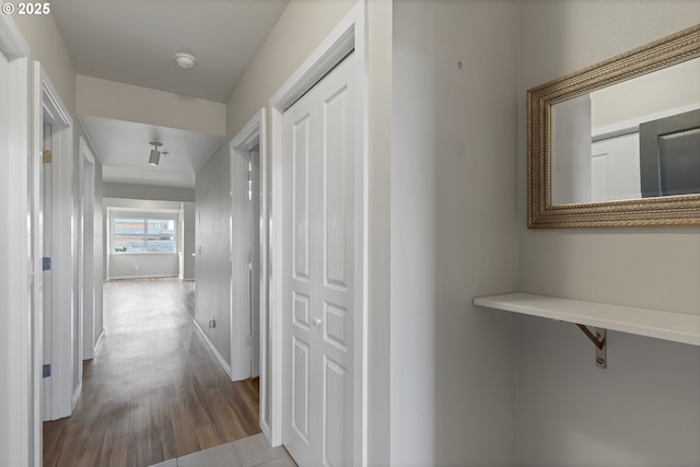 hall with tile patterned flooring