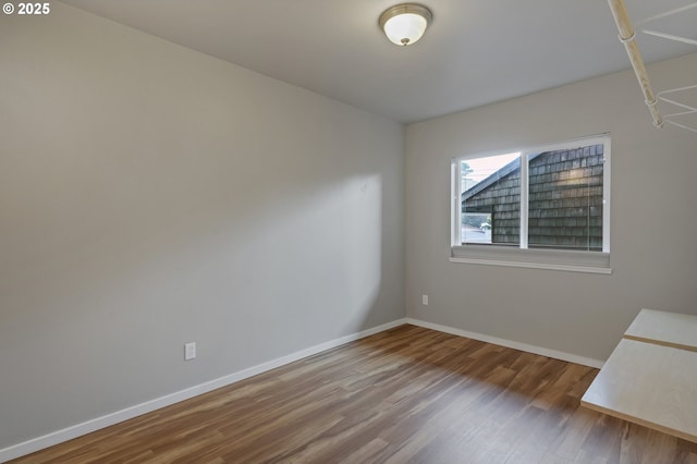 unfurnished room featuring hardwood / wood-style floors