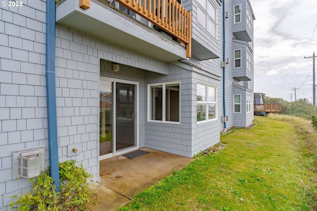 view of side of home featuring a lawn