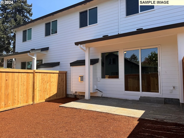 back of property with a patio area