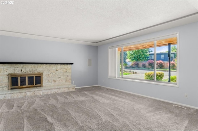 19555 SW Cascadia St, Beaverton, OR 97078 - unfurnished living room featuring carpet floors, a textured ceiling, baseboards, and a fireplace