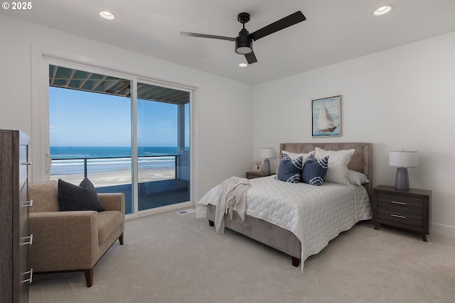1515 NW Spring St, Newport, OR 97365 - bedroom with access to exterior, light carpet, a water view, recessed lighting, and ceiling fan