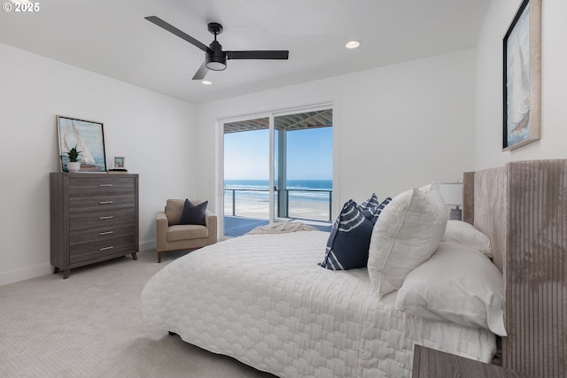 1515 NW Spring St, Newport, OR 97365 - bedroom with access to outside, a water view, light colored carpet, baseboards, and recessed lighting