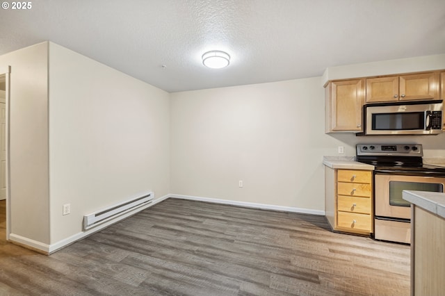 kitchen with a baseboard heating unit, light wood-type flooring, appliances with stainless steel finishes, and a textured ceiling