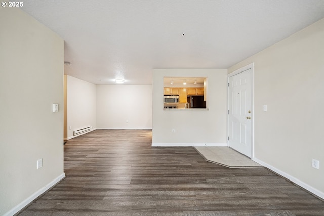 unfurnished living room with a baseboard radiator and dark wood-type flooring