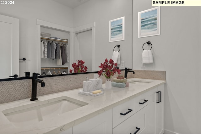 3840 S 44th Ln, Ridgefield, WA 98642 - full bathroom with double vanity, a walk in closet, and a sink