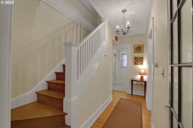 803 NE Laurelhurst Pl, Portland, OR 97232 - entryway featuring a chandelier, light wood-style floors, stairs, and baseboards