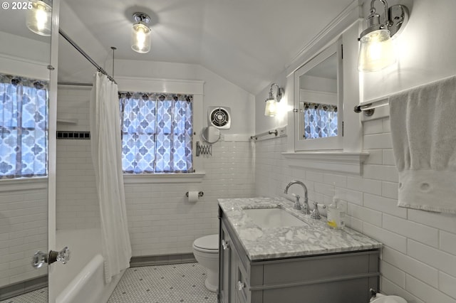 803 NE Laurelhurst Pl, Portland, OR 97232 - full bath with toilet, healthy amount of natural light, tile walls, vanity, and lofted ceiling
