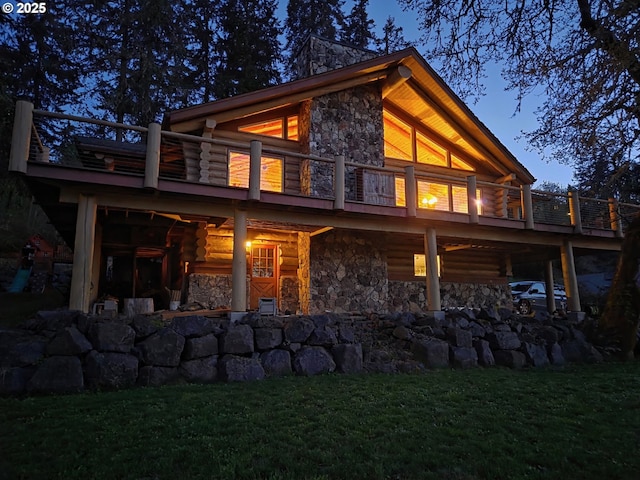 6715 Ivy St, Springfield, OR 97478 - back of house featuring stone siding, log exterior, a yard, and a balcony