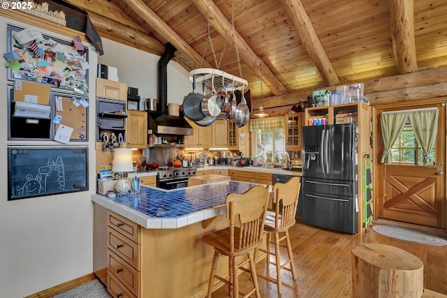 6715 Ivy St, Springfield, OR 97478 - kitchen featuring black fridge with ice dispenser, high end range, open shelves, wood ceiling, and light wood-style floors