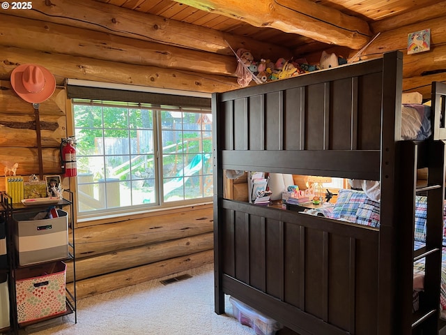 6715 Ivy St, Springfield, OR 97478 - carpeted bedroom with rustic walls and wooden ceiling with exposed beams