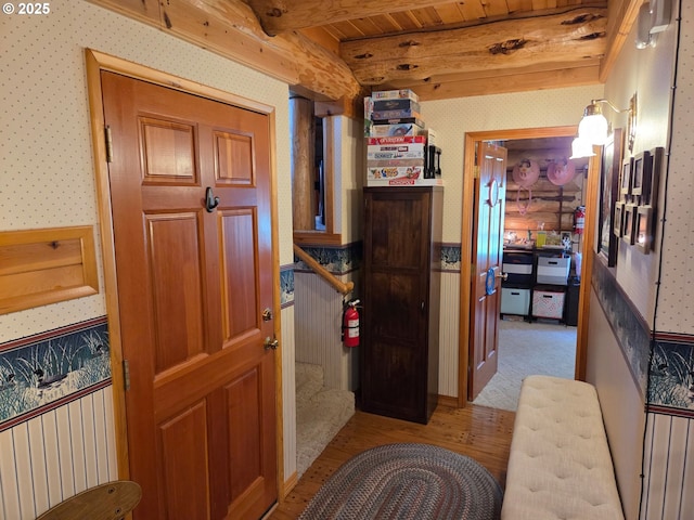 6715 Ivy St, Springfield, OR 97478 - hall featuring wallpapered walls, light wood-type flooring, beam ceiling, and a wainscoted wall