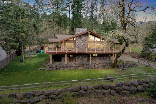 6715 Ivy St, Springfield, OR 97478 - back of house featuring stone siding, a wooden deck, a chimney, and log siding