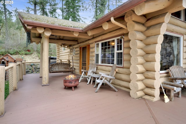 6715 Ivy St, Springfield, OR 97478 - view of patio featuring a wooden deck and an outdoor fire pit